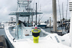 ACR GlobalFix V6 EPIRB placed on boat dock in marina environment for marine safety equipment setup