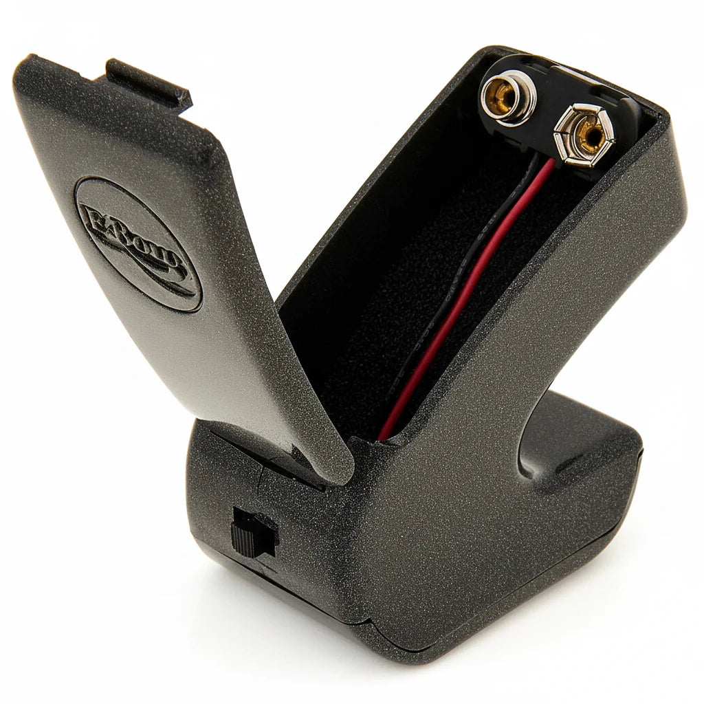 Ebow Plus open battery compartment with 9V battery clip for powering electronic guitar sustainer