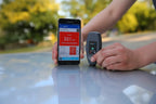 Wireless NexPTG paint thickness gauge with Bluetooth app displaying coating thickness results