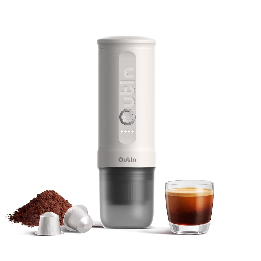 OutIn Nano portable espresso maker with espresso cup, capsules, and ground coffee setup