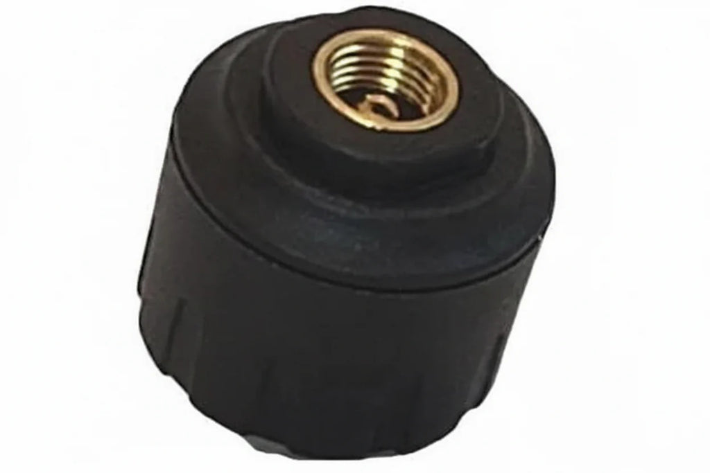 Close up of TST 507 TPMS cap sensor with threaded valve connection for tire pressure monitoring